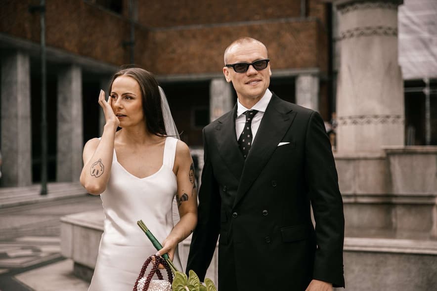 Wedding couple standing outdoors
